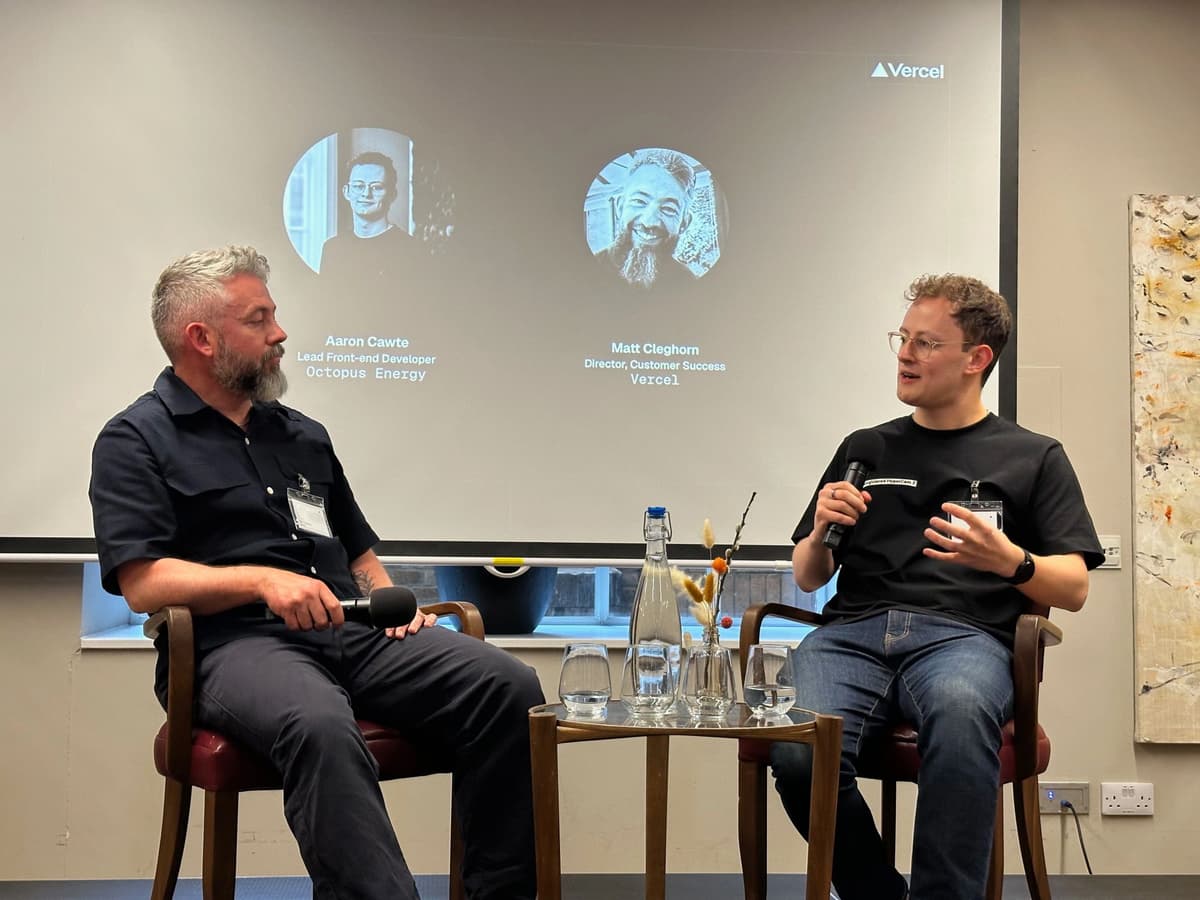 Aaron seated on stage, in conversation with Matt Cleghorn of Vercel